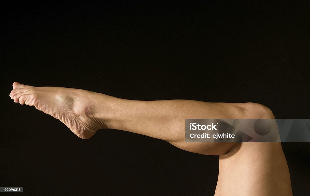 Athleten s Bein - Lizenzfrei Schwarzer Hintergrund Stock-Foto