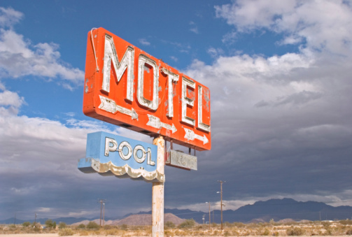 Two young women taking pic's at Roy's Motel in Amboy, California. The photo was taken April 20th 2023 in Amboy, USA at historic route 66.