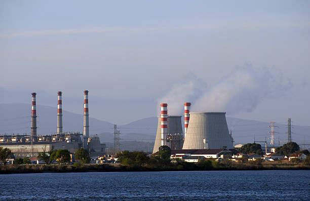 istock Power plant cooling towers emitting steam 92096943