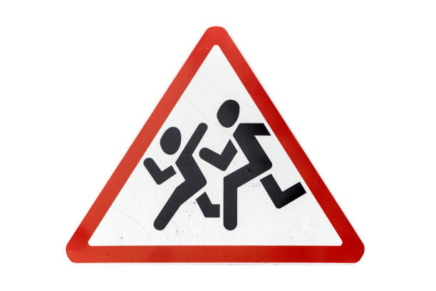 Triangular scratched red border road sign 'Children' isolated on white.
