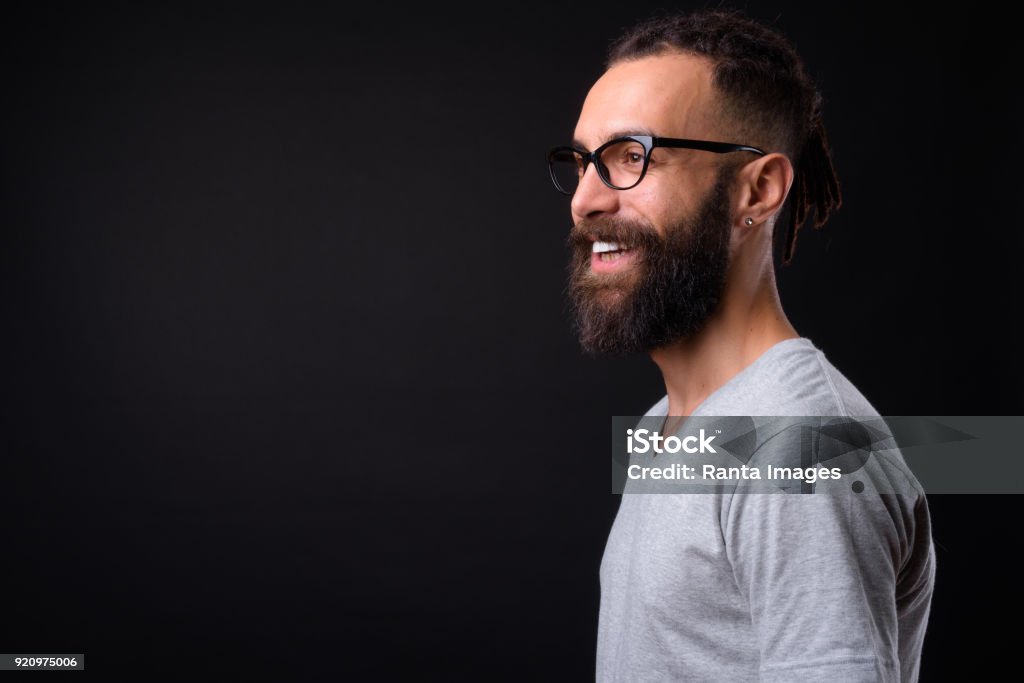 Handsome Young Man Against Black Background Studio Shot Of Handsome Young Man Against Black Background Profile View Stock Photo