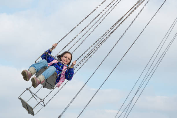 istock Girl flying on the carousel 920975072