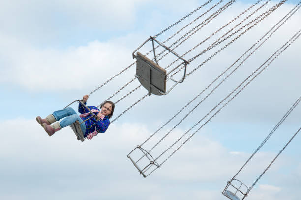 istock Girl flying on the carousel 920975096