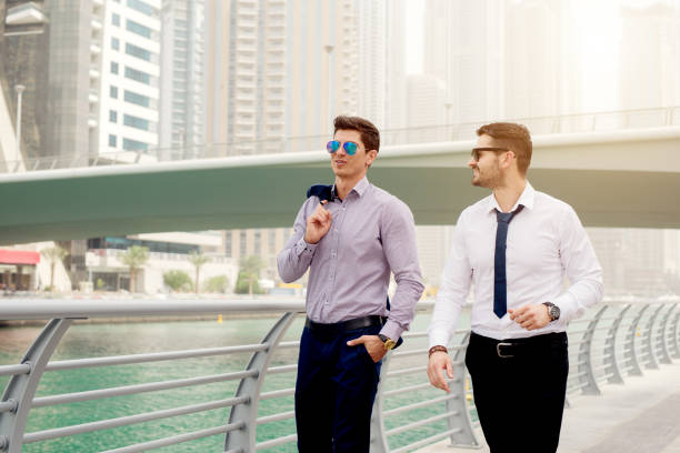 istock Two businessman walking and talking at Dubai Marina. 920978904