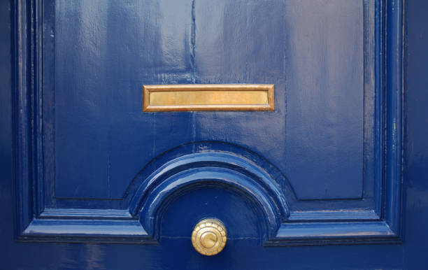istock Massive blue door with yellow mail slot and round handle 92097920