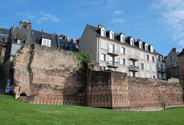 istock Antique ruinous boundary wall in modern town, France 92097936