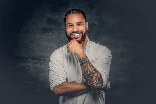 istock Black man with tattoo on arms. 920979398