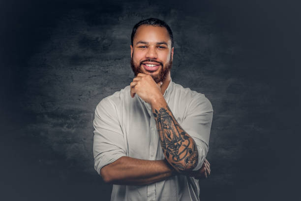istock Black man with tattoo on arms. 920982244
