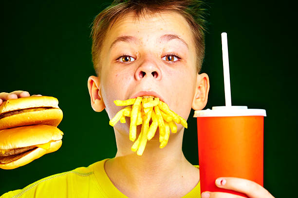 istock child and fast food. 92098942