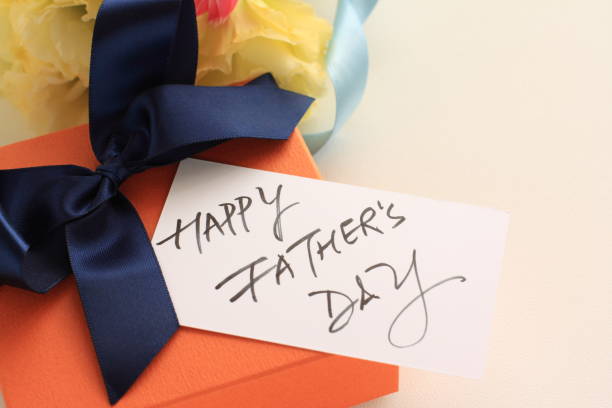 istock Gift box and hand writting Father's day card 920993474