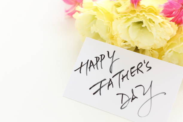 istock flower and hand writting Father's day card 920993530