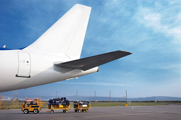 istock airplain tale and luggage cart 92099673