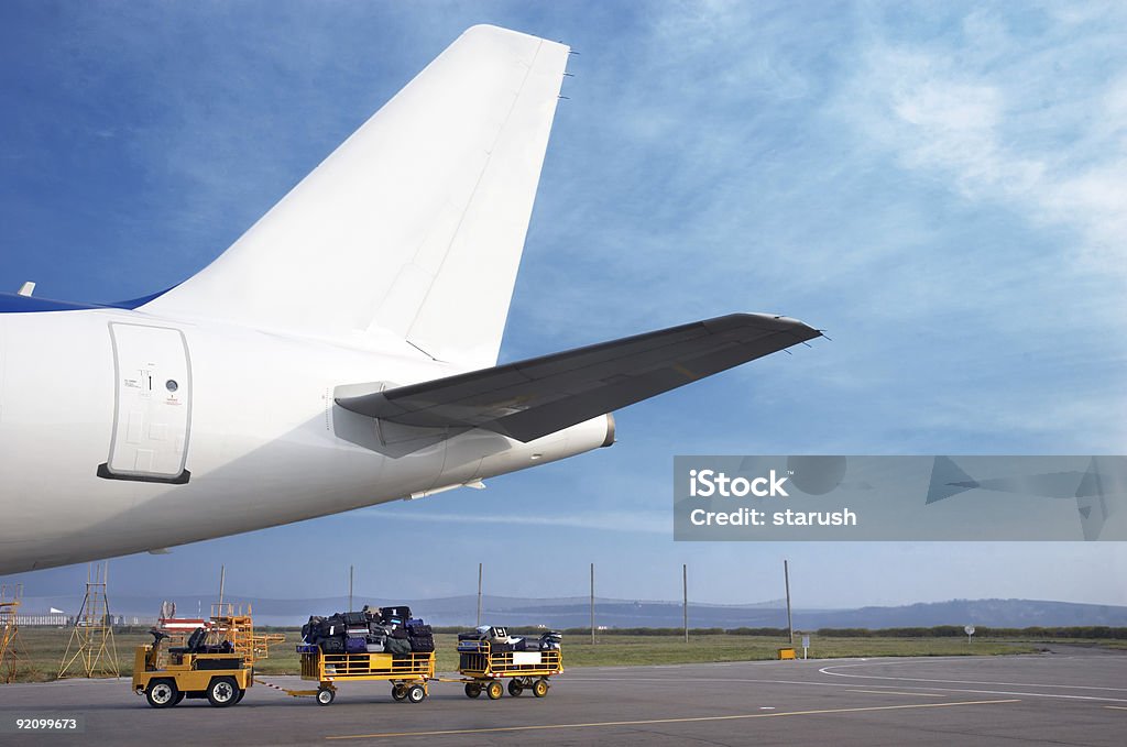 airplain tale and luggage cart  Airplane Stock Photo