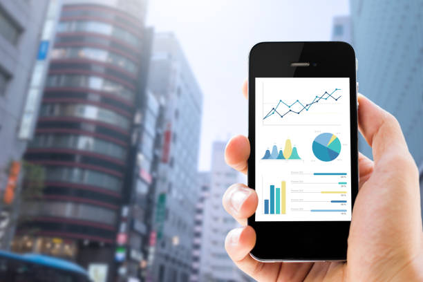 istock Close-up of smartphone showing graphs 920998270
