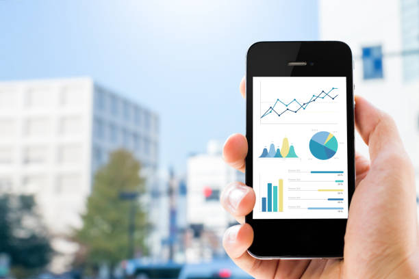 istock Close-up of smartphone showing graphs 920998284