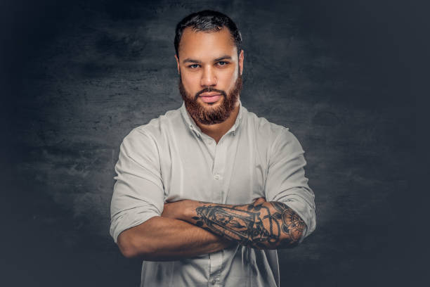 istock Black man with tattoo on arms. 920998300