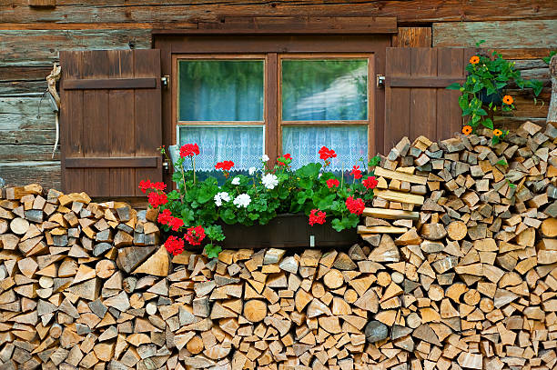 istock Nice window for a wooden cabin surrounded by firewood 92100031