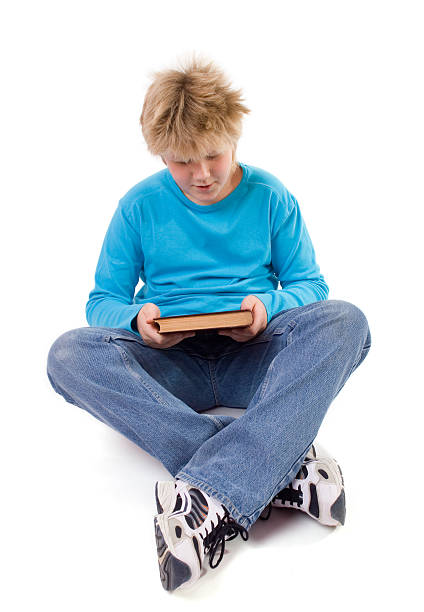 istock teenager boy with a book 92100617