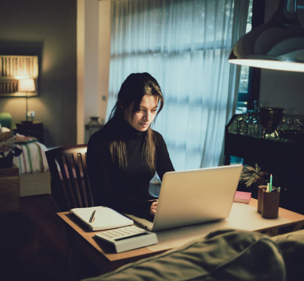 istock Woman working with laptop computer at home 921007222