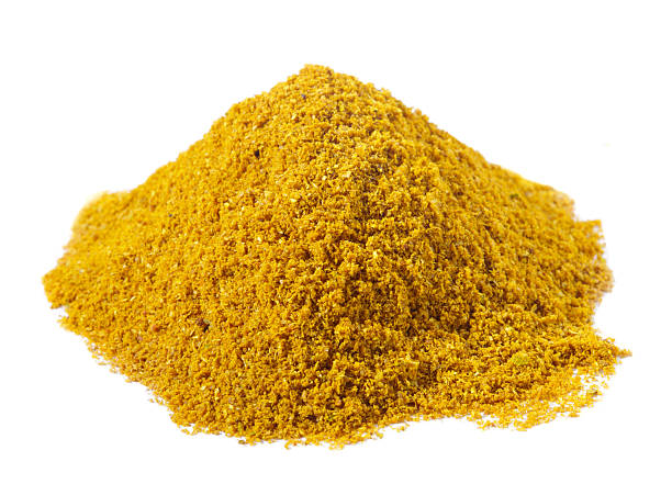 istock spices - pile of Hot madras curry over white 92100964