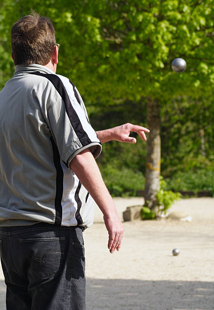 istock Man plays petanque, french game. 92101176