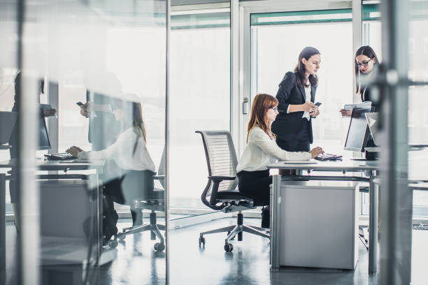 istock Three young businesswomen working in the office 921013376