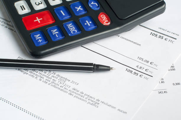 istock Financial and budget concept. Calculator, pen and financial document on office table 921013446