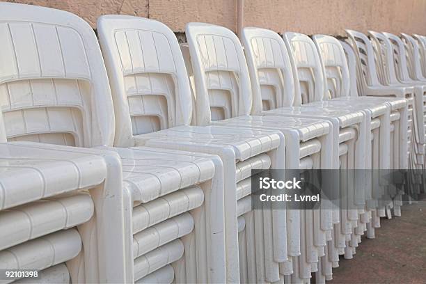 Stacked White Chairs Stock Photo - Download Image Now - Breaking, Chair, Closed