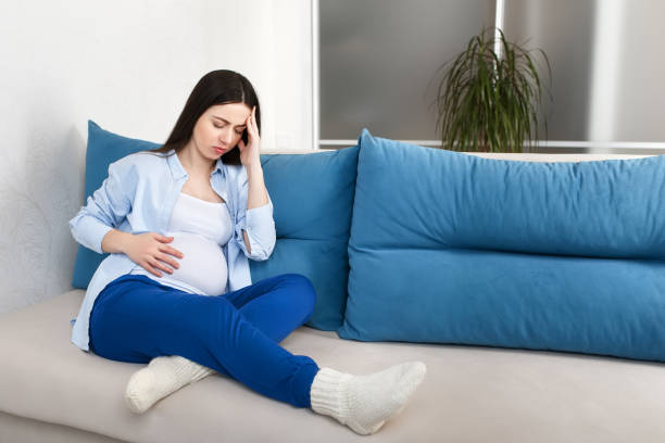 istock pregnant woman with a headache 921019778