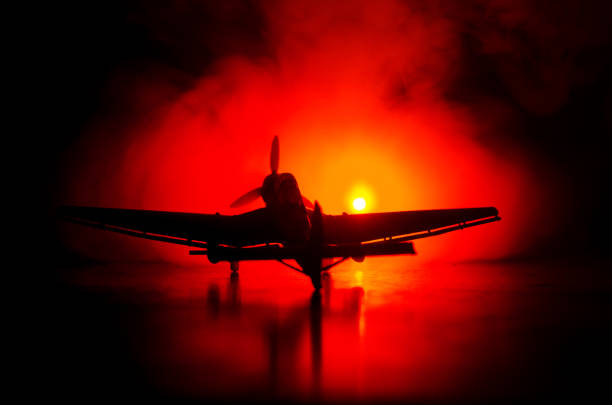 avión de reacción modelo alemán junker (ju-87) en la posesión. fondo oscuro fuego naranja. escena de guerra. enfoque selectivo (colocación de posición diferencia) - styka fotografías e imágenes de stock