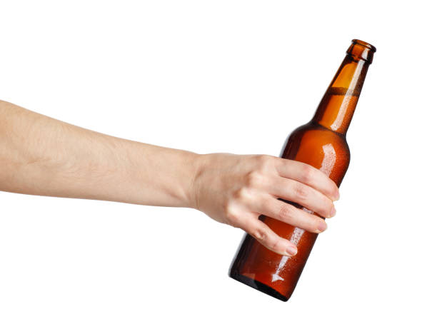 istock female hand with beer brown bottle 921022660