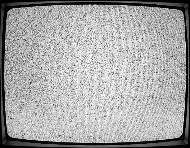 A close-up of a white noise on a TV screen analog TV static - retro crt television - off air - white noise television static photos stock pictures, royalty-free photos & images