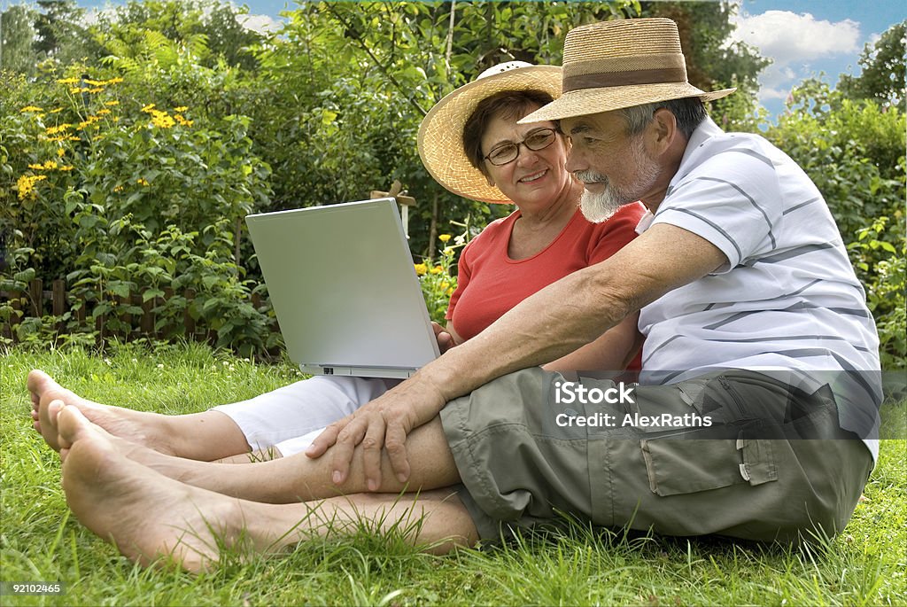 senior couple in garden  Active Lifestyle Stock Photo