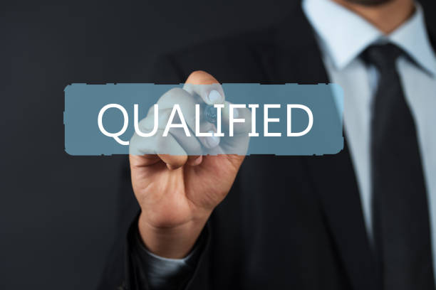istock Business man pointing the text: Qualified 921029828