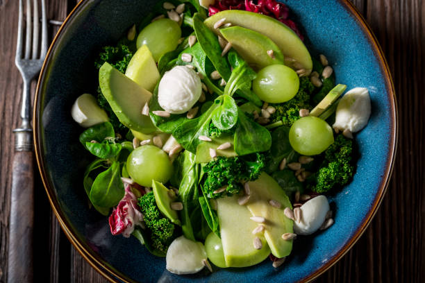 istock Closeup of kale salad with avocado, lettuce and grape 921032010