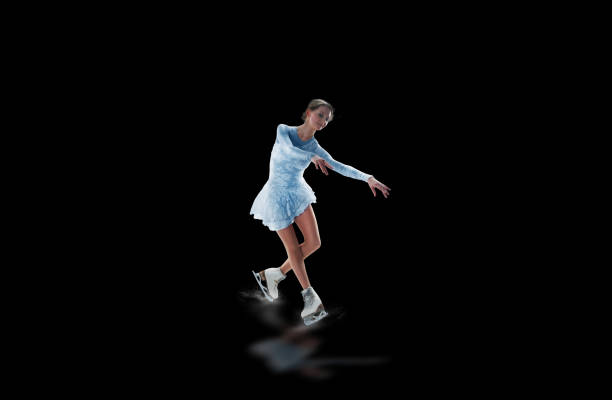 istock figure skater isolated on black 921032502