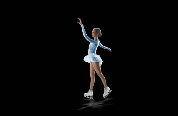 istock figure skater isolated on black 921032506