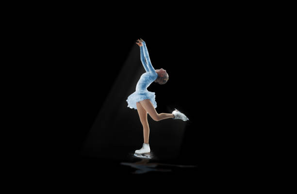 istock figure skater isolated on black 921032544