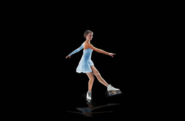 istock figure skater isolated on black 921032550