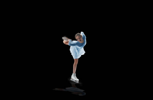 istock figure skater isolated on black 921032626