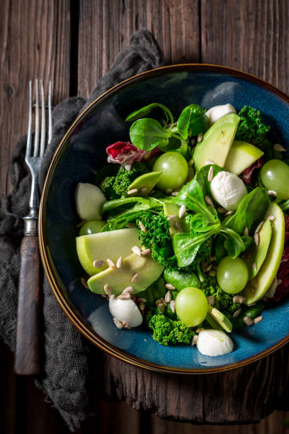 istock Top view of kale salad with vegetables and avocado 921032838