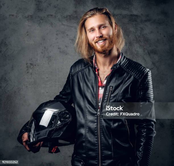 A Man In Leather Jacket Holds Motorcycle Helmet Stock Photo - Download  Image Now - Adult, Adults Only, Adventure - iStock
