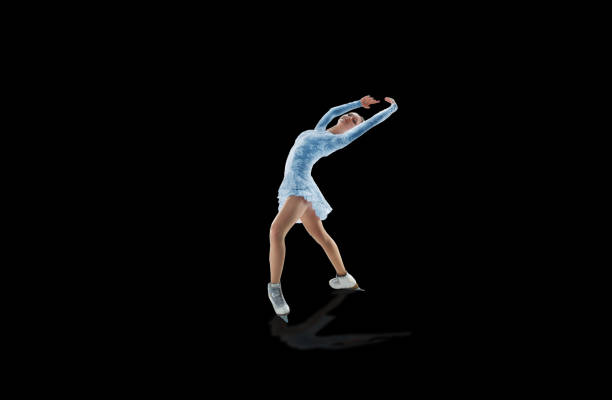 istock figure skater isolated on black 921035462