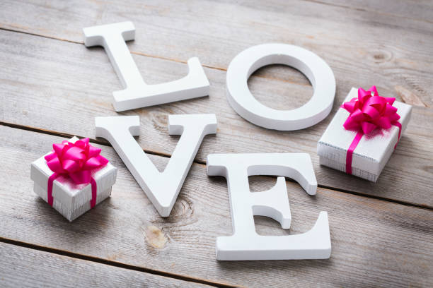 istock Valentines day holiday letters text message love card background 921039036