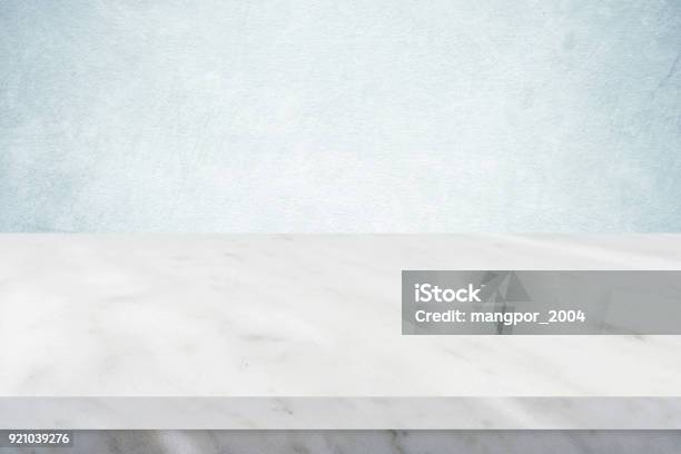 Empty White Marble Table Over Green Cement Wall Background Banner Table Top Shelf Counter Design For Product Display Montage Stock Photo - Download Image Now