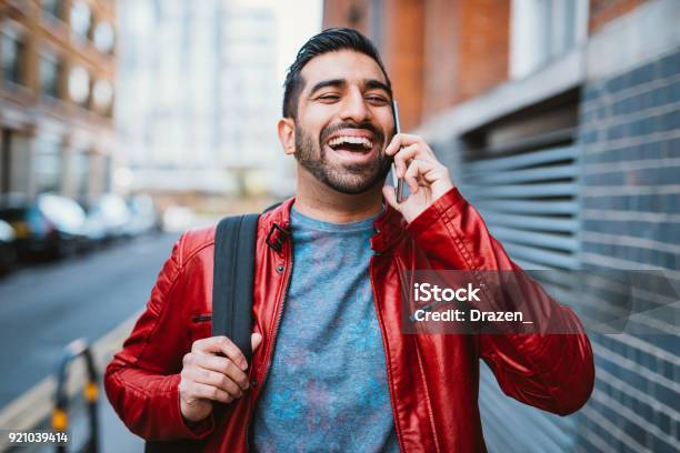 Man Is Using Mobile Phone To Talk To Friends Stock Photo - Download Image Now - Men, Using Phone, Indian Ethnicity