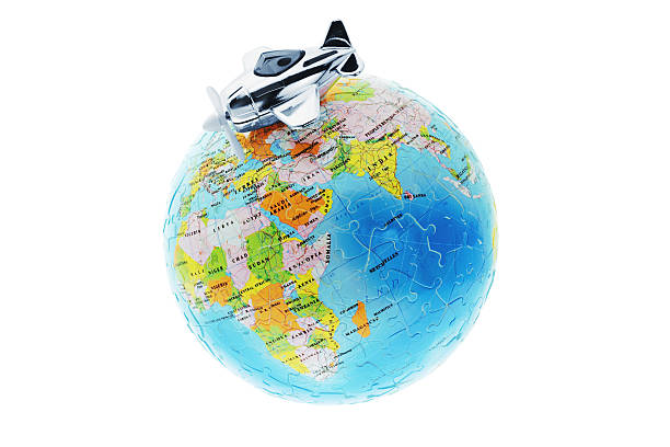 istock Miniature toy aircraft on globe 92104342