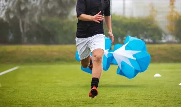 Photo of Soccer Football Endurance Training. Speed or Sprint Testing with Parachute. Professional Soccer Strength Test