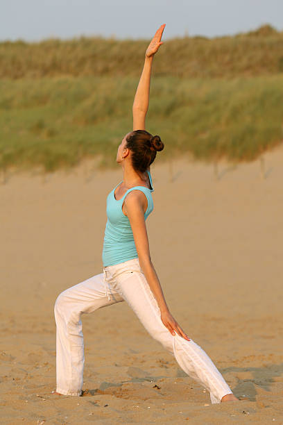 istock Yoga on the beach 92105006