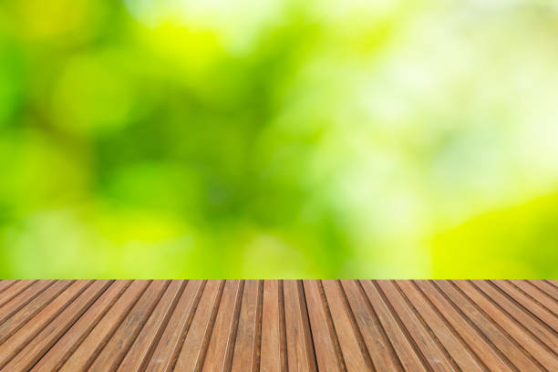 istock wooden table or wooden mock up over blurred green background 921054164